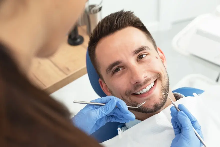 A patient in conversation during a dental visit, supporting photograph